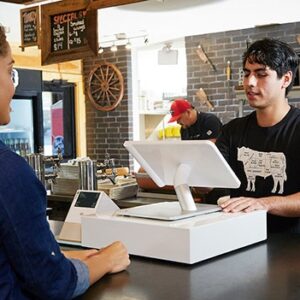 Merchant using a Square POS system inside their restaurant